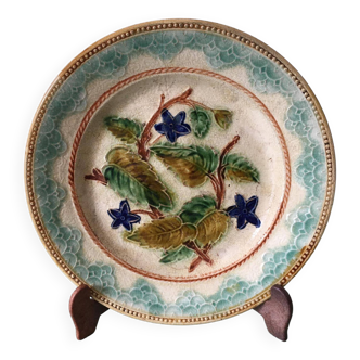 Old barbotine dessert plate. Floral patterns