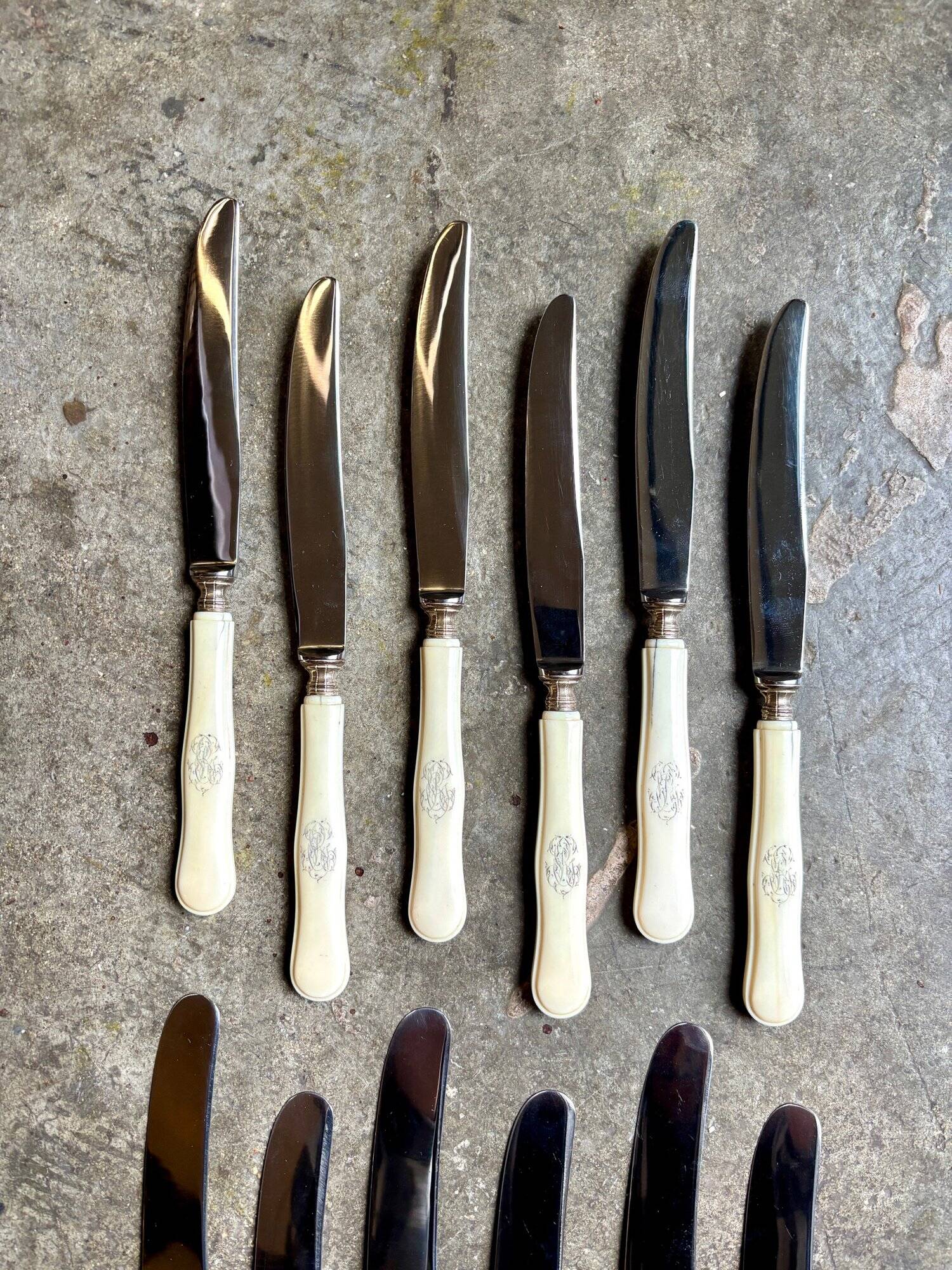 12 stainless steel and monogrammed bone knives