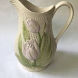 Barbotine pitcher with embossed tulip decoration and spike