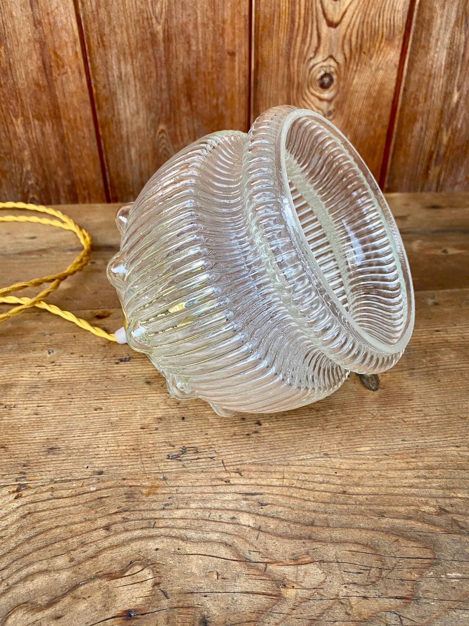 Vintage flower-shaped transparent glass pendant globe.