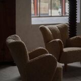 Pair of Danish Art Deco modern lounge chairs in sheepskin with lambswool and elm, 1940s.