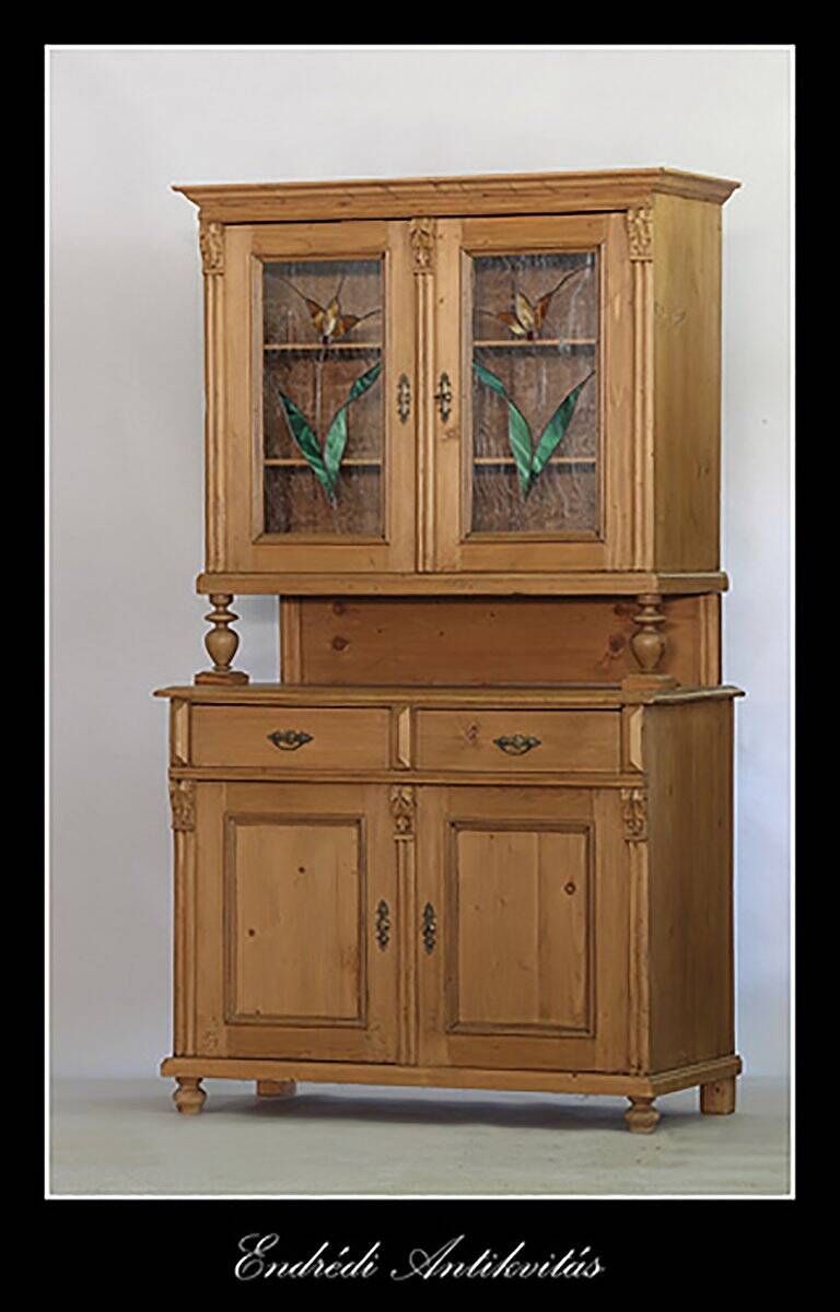 Brown pine kitchen cabinet with floral stained glass, 1920s vintage style.