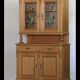 Brown pine kitchen cabinet with floral stained glass, 1920s vintage style.