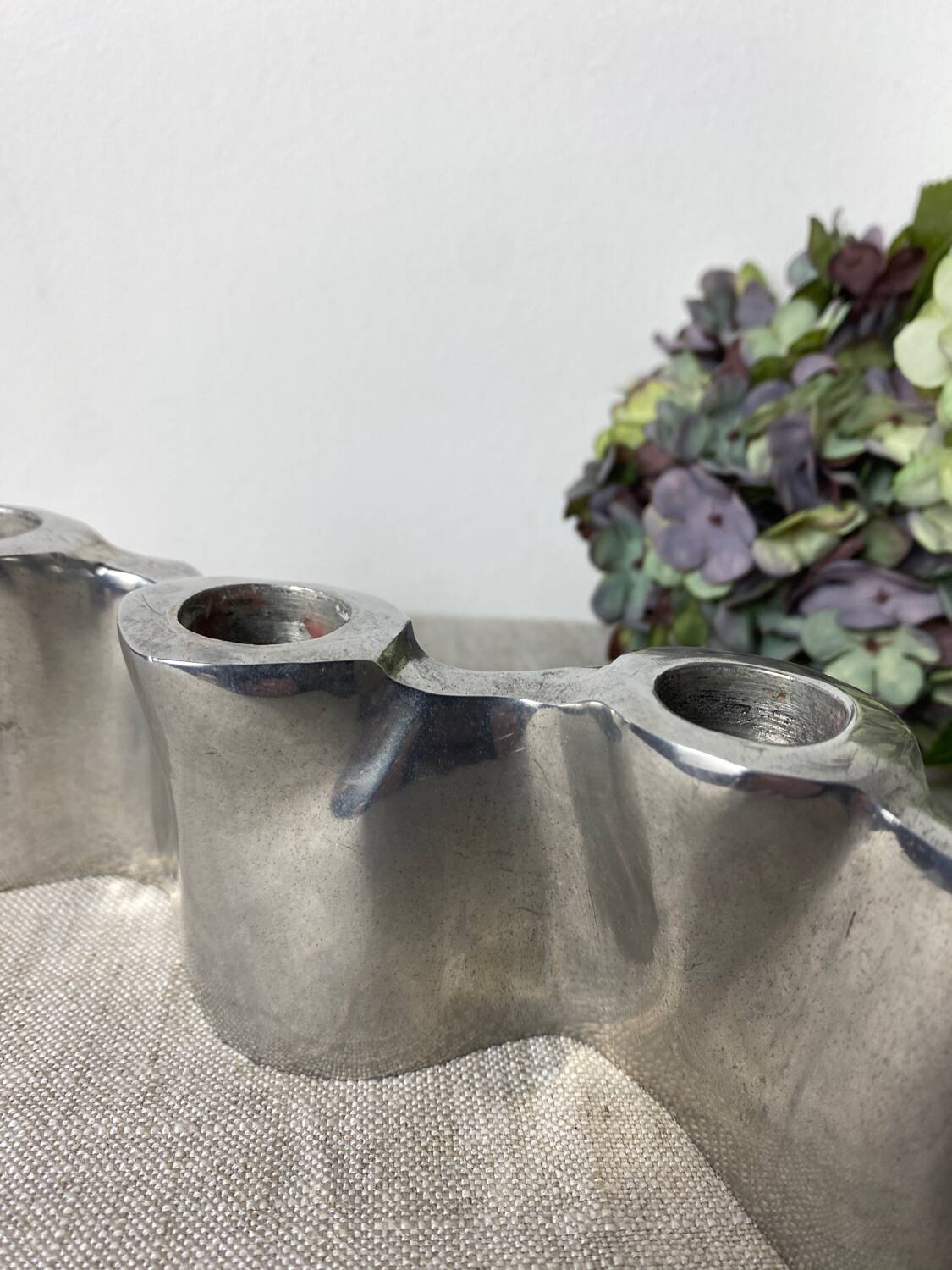 Brushed aluminum candle holder