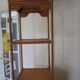 Storage column, wooden bookshelf and woven rattan.