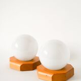 Pair of globe wall lights in opaline with a pine base, 1980.