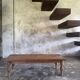 Brown Indonesian teak coffee table, with a border and cylindrical legs H40 L103.
