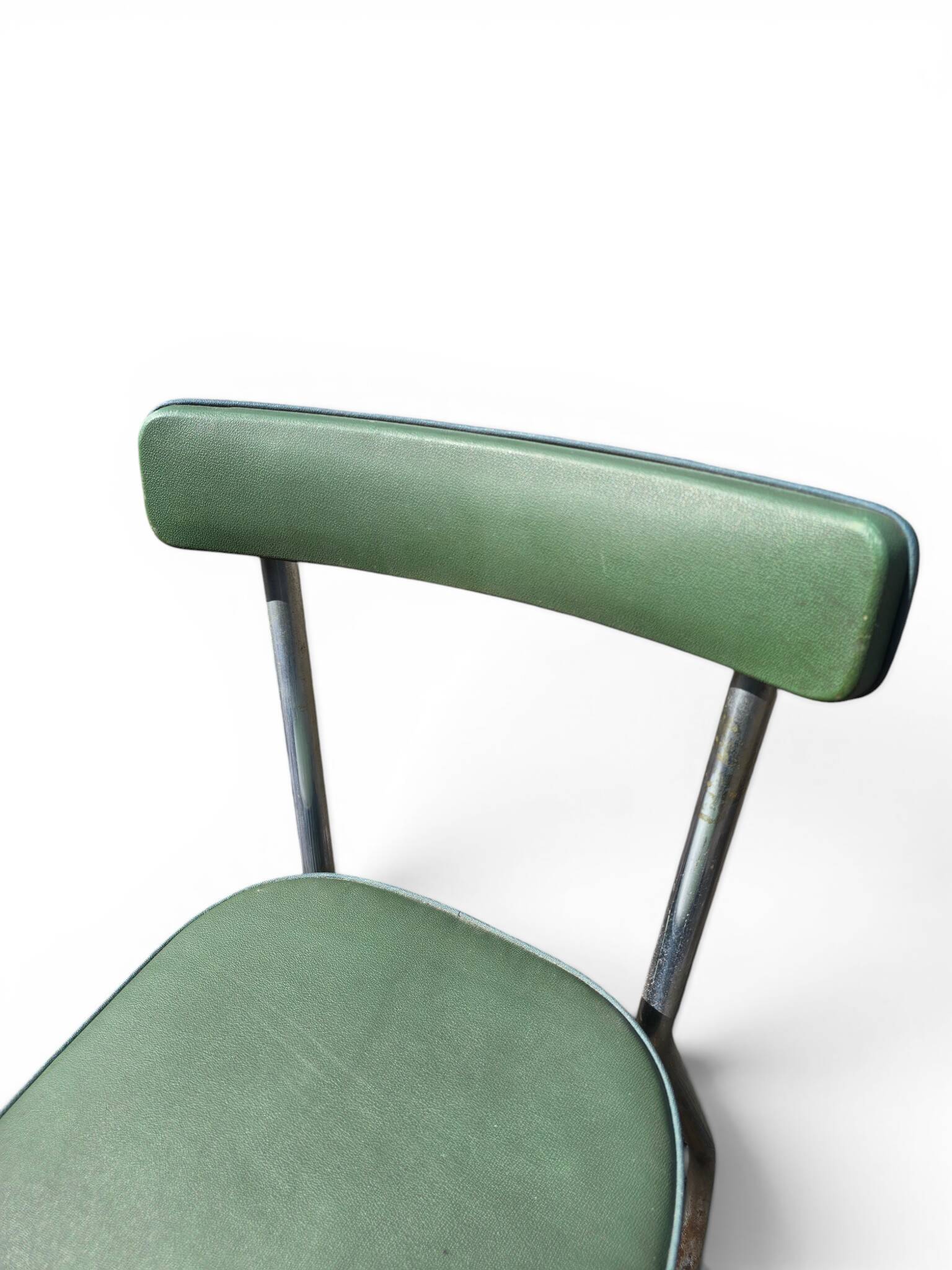 Vintage green faux leather chair with metal frame, 1960s.