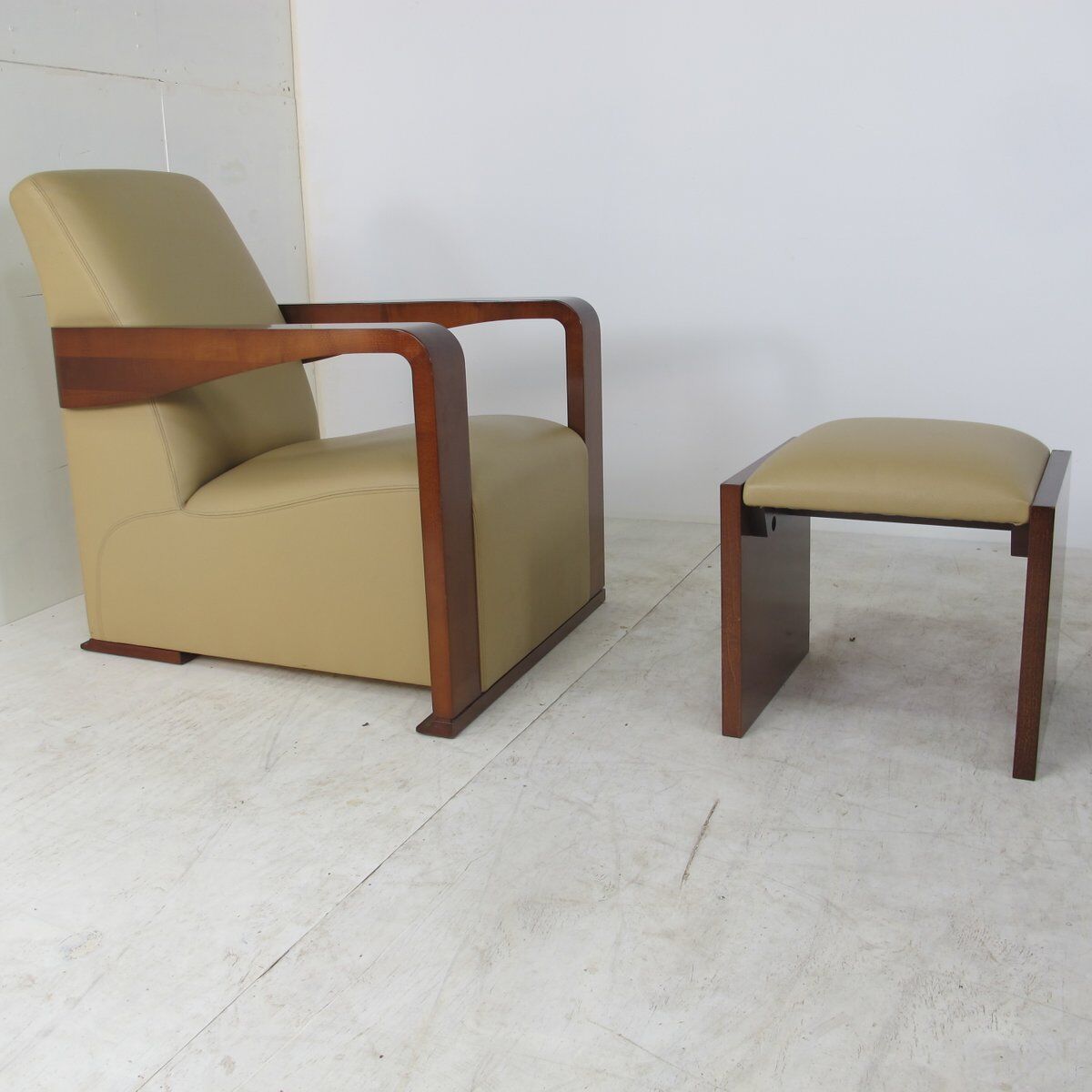Leather armchair and art deco wood with Oottoman by Hugues Chevalier 2000s