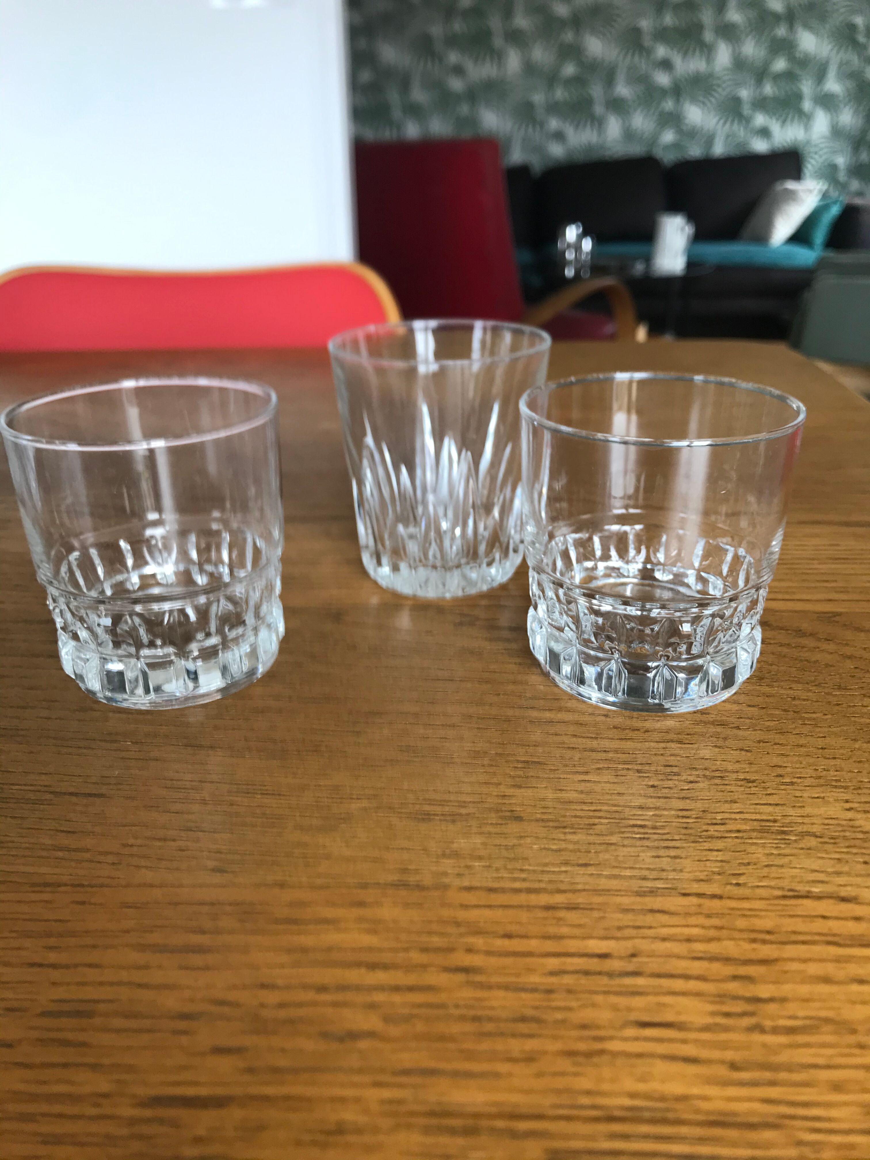 Mismatched decanter and whiskey glasses