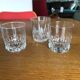 Mismatched decanter and whiskey glasses