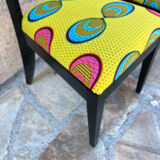 Pair of chairs upholstered with wax fabric