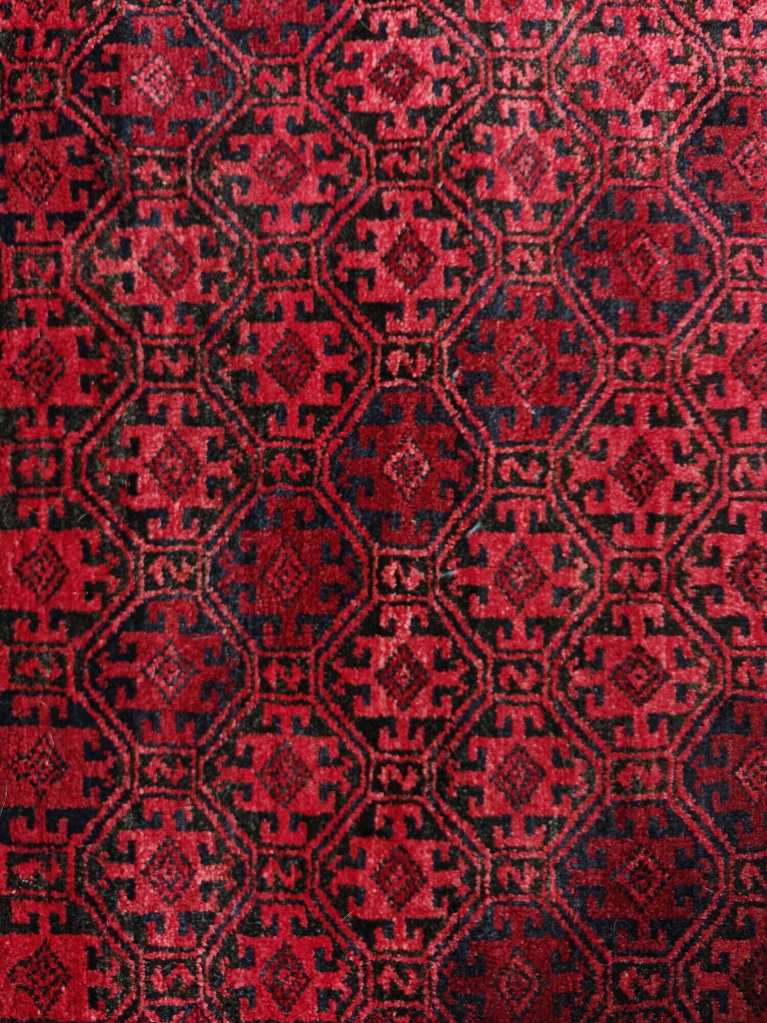 Vintage handmade Baluch rug with geometric pattern from the 1950s.