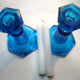 2 blue glass doll candlesticks