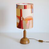 Wooden floor lamp with low printed shade