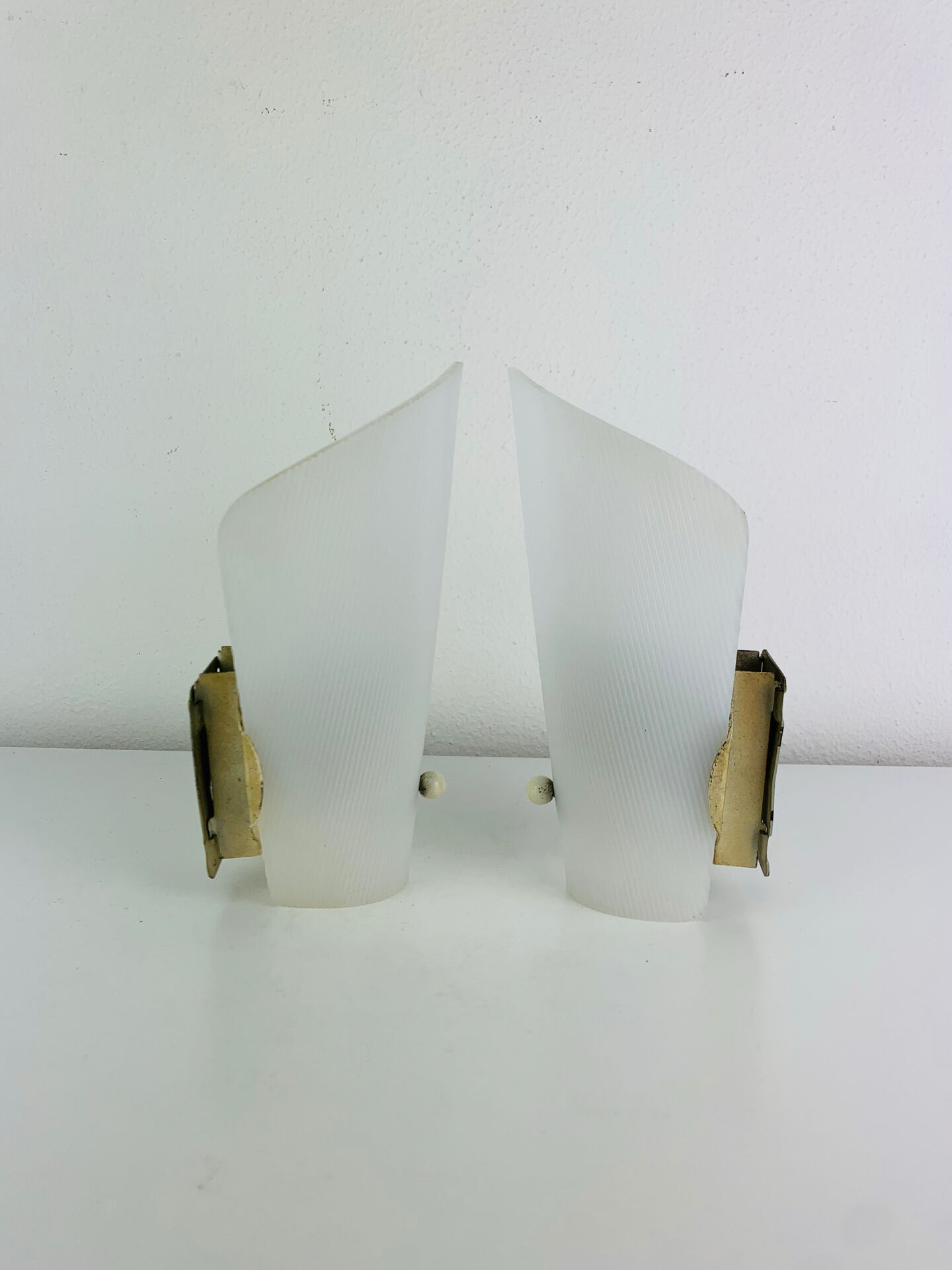 Pair of 1950s striped plastic wall lights.