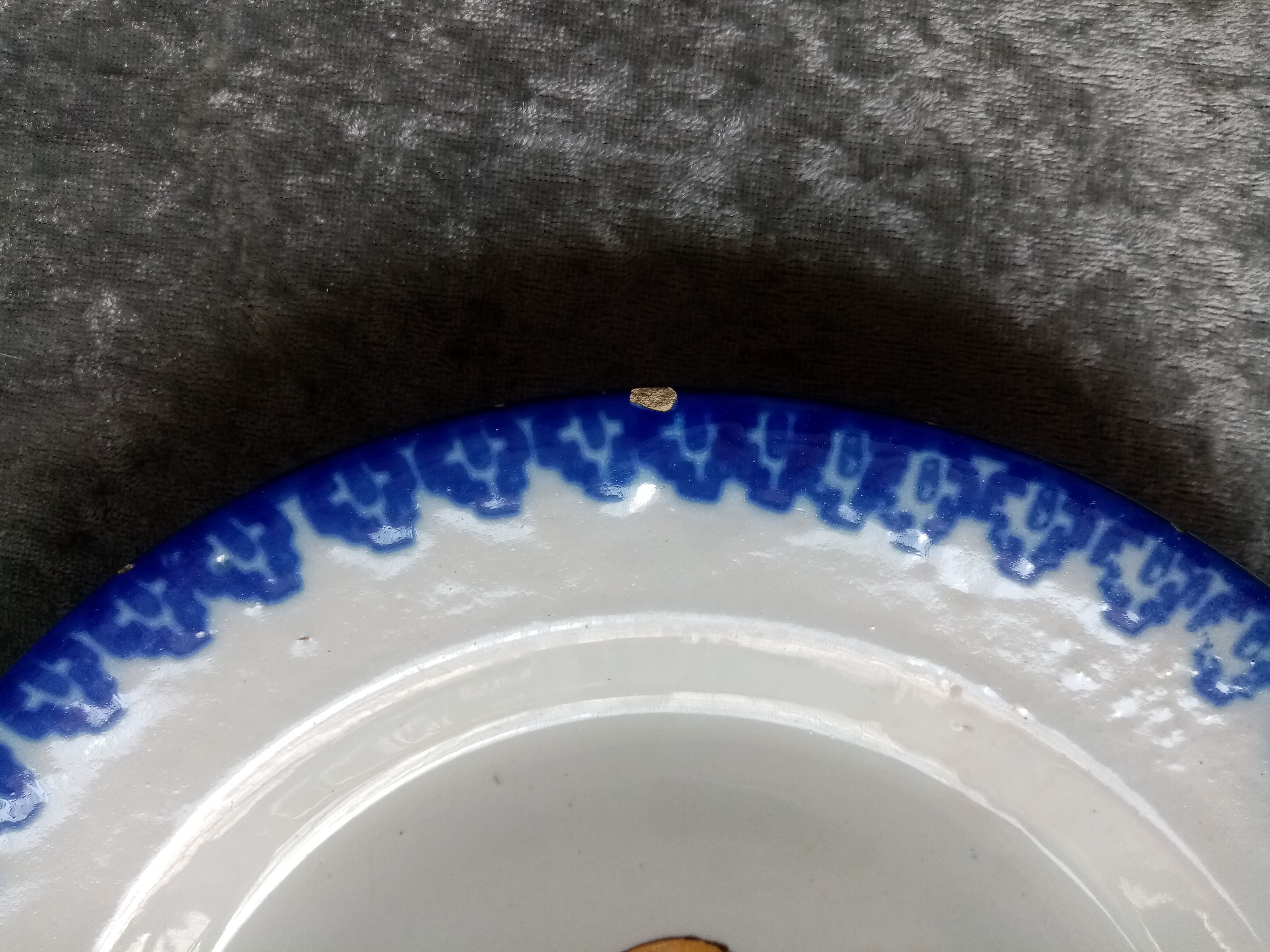 18th century earthenware decorative plate signed Saint Clement with royal coat of arms decoration