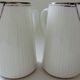 Pair of creamers in white porcelain enhanced with platinum