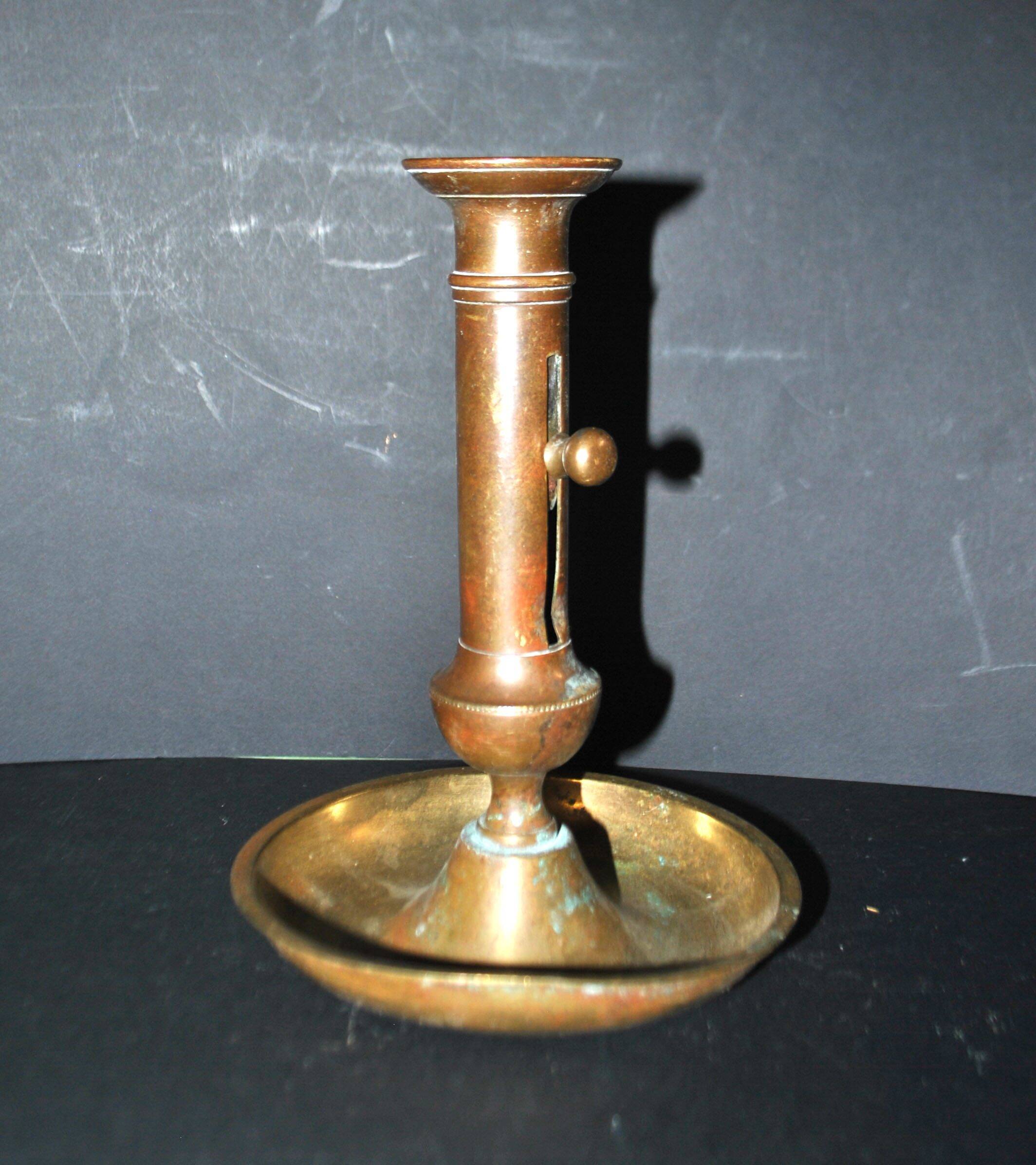 Antique push candle holder, 18th century gilded carved bronze candlestick.