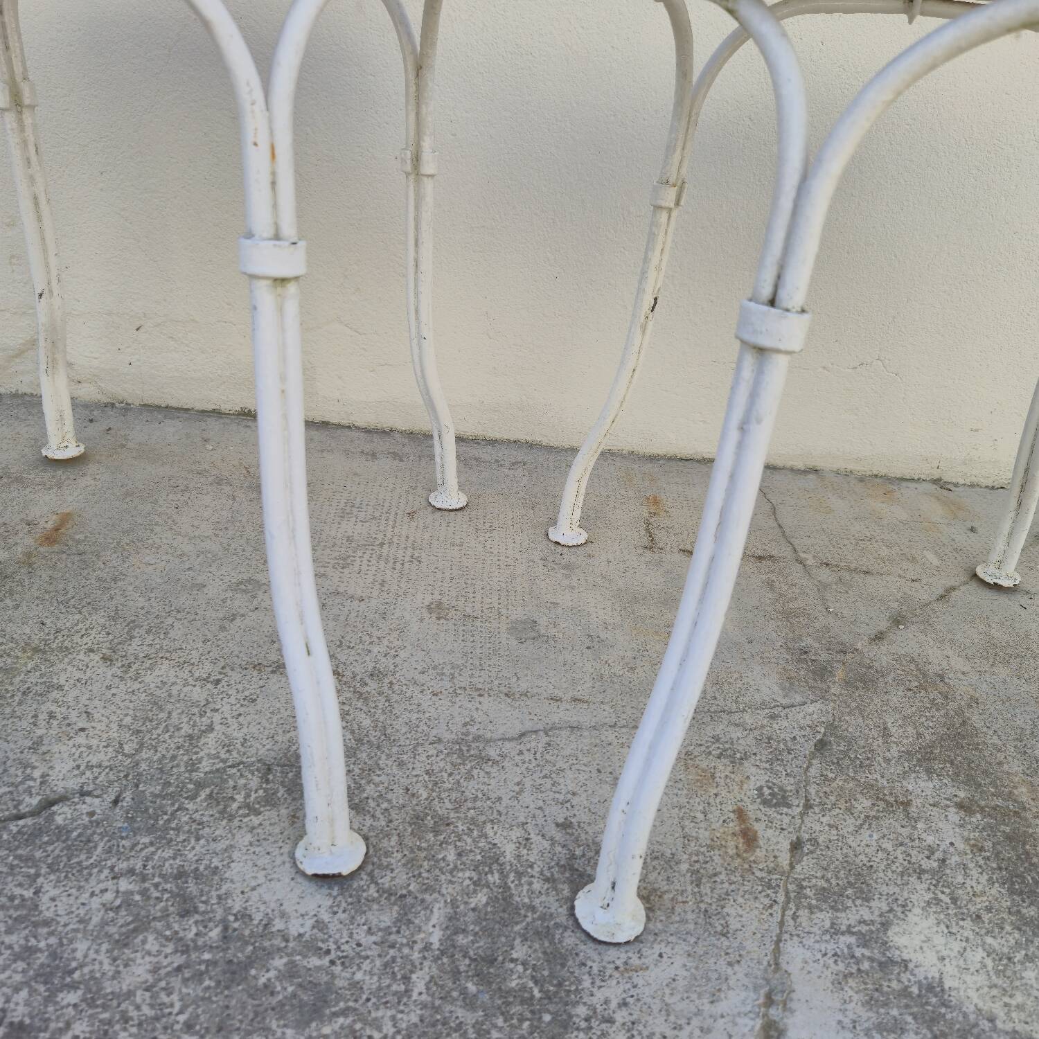 Pair of wrought iron garden chairs, antique manufacture