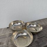 Silver-plated metal dish topped with an acorn