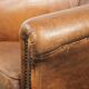 Vintage sheepskin club armchair in a subtle size with warm colours