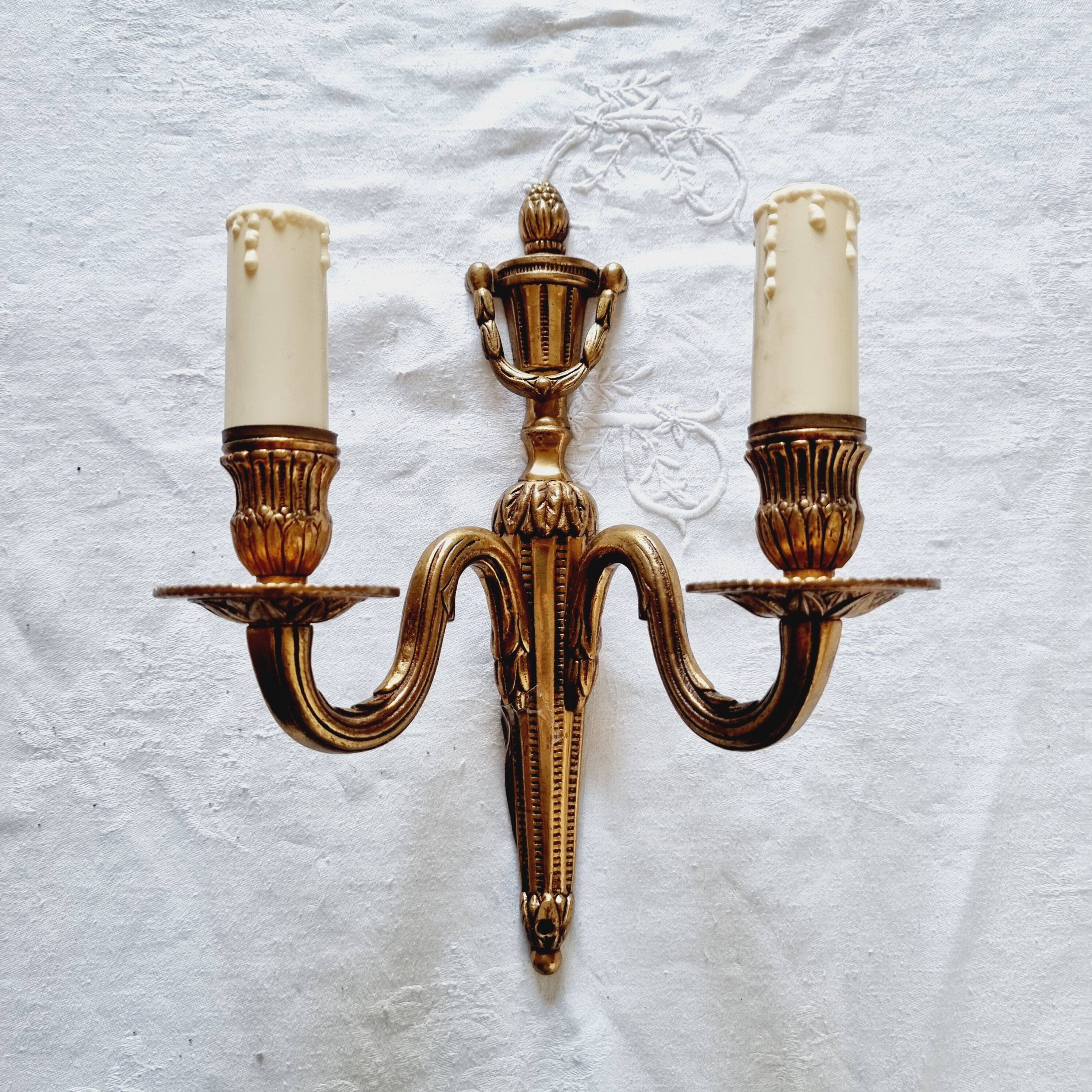 French Empire-style wall sconce or chandelier in bronze with an antique gold patina.