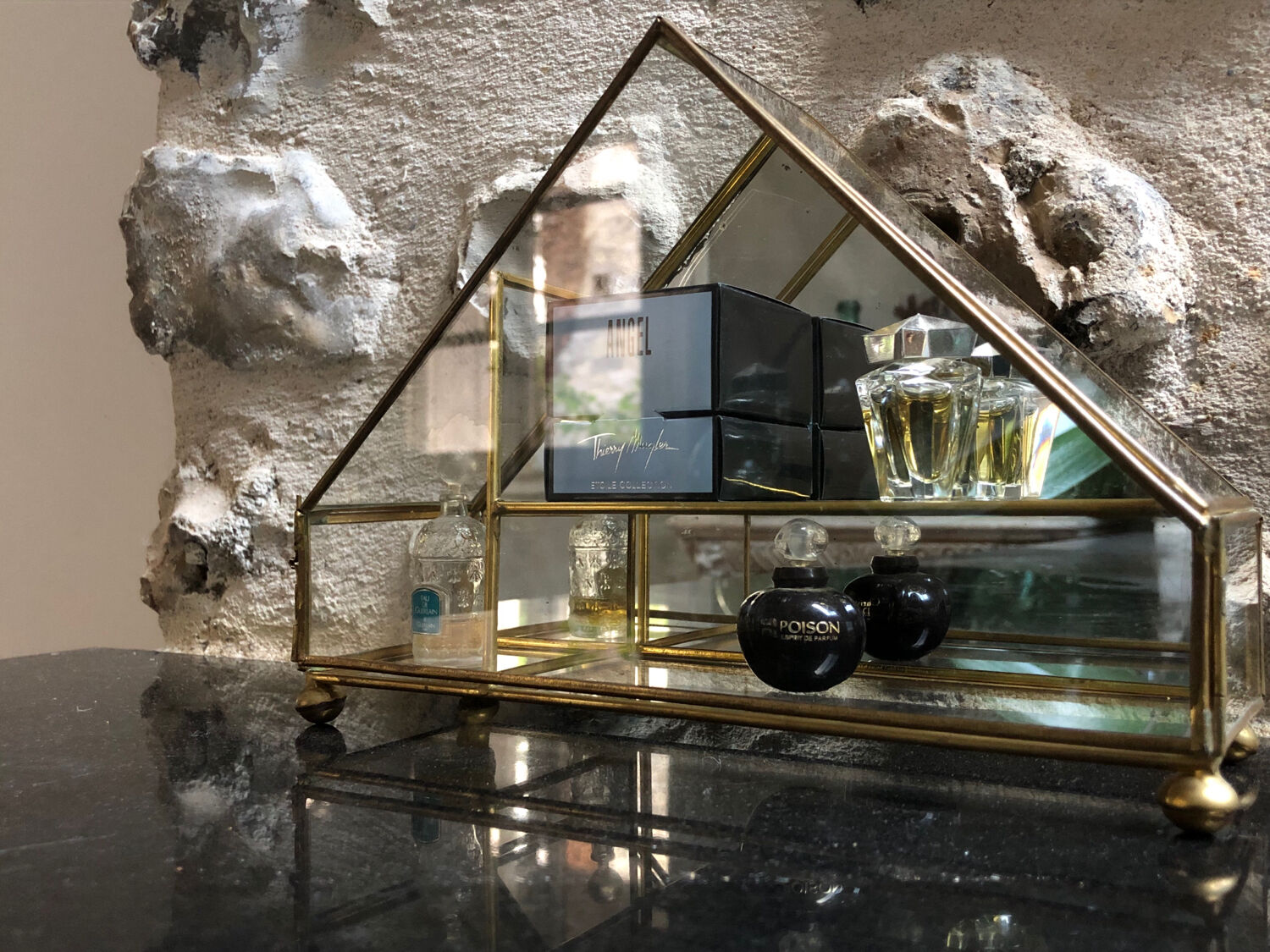 Vintage showcase, glass and brass for collectibles.
