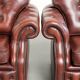 Vintage set of 2 cowhide leather Chesterfield armchairs in a brown colour