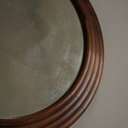 Round wooden wall decorative mirror, carved frame, mid-20th century, 1950s.