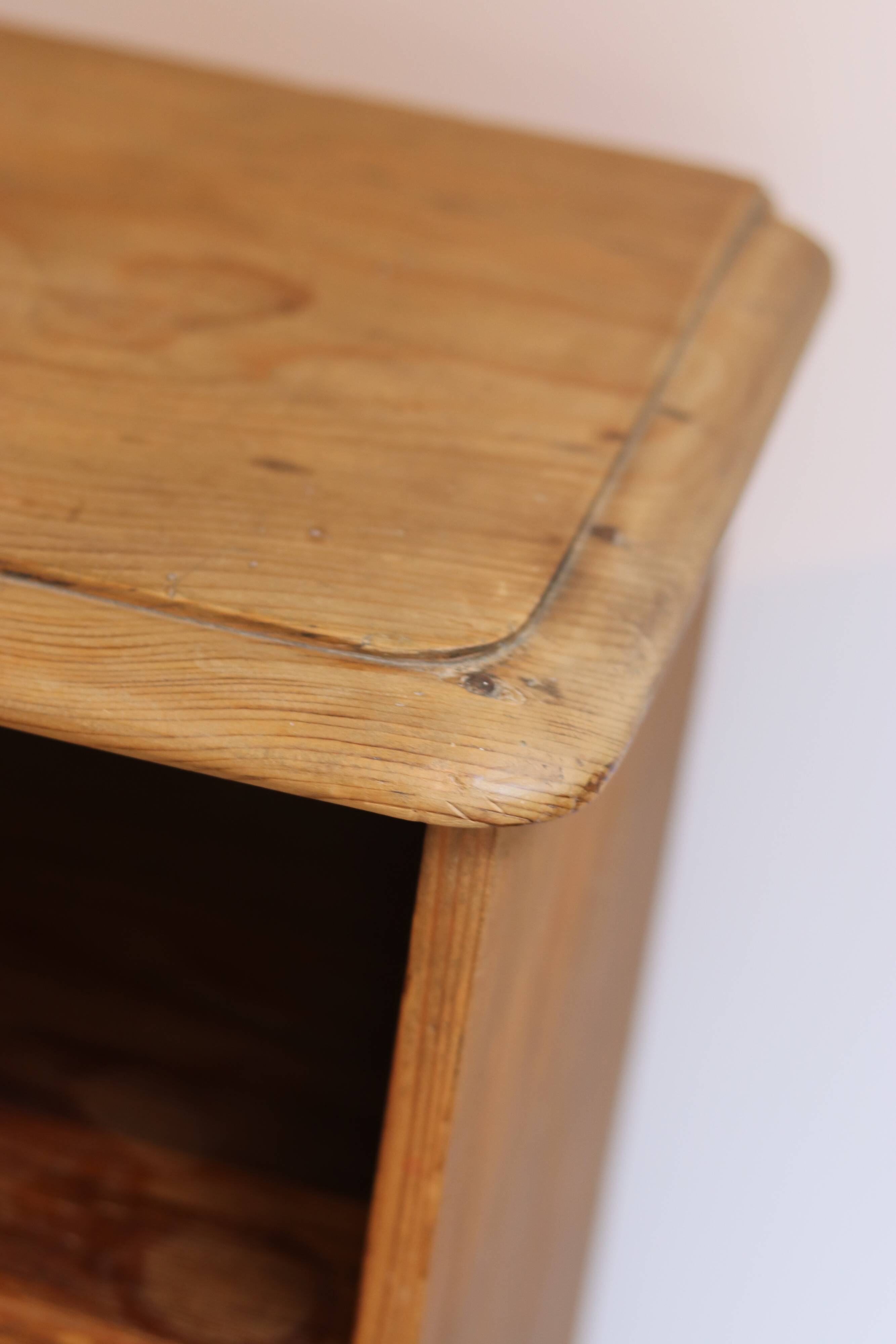 Large storage unit with compartments in waxed pine, early 20th century.