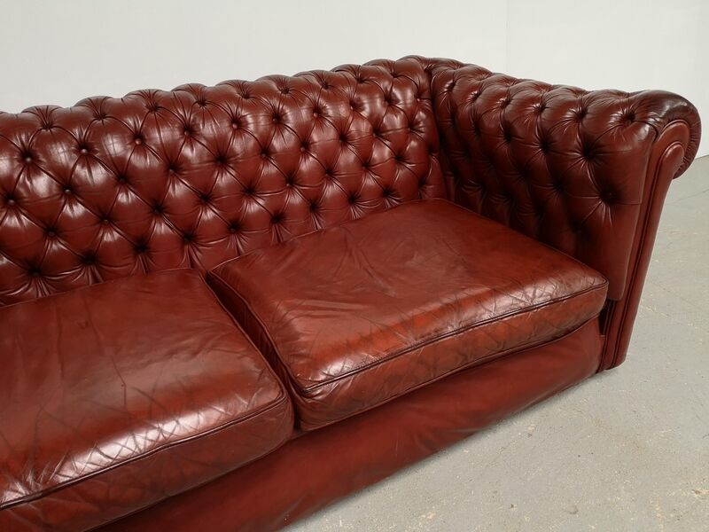 Old red leather Chesterfield sofa