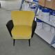 Pair of vintage 1950s cocktail chairs in yellow velvet and black faux leather, wooden frame.