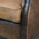 Vintage sheepskin club armchair with character and a beautiful patina