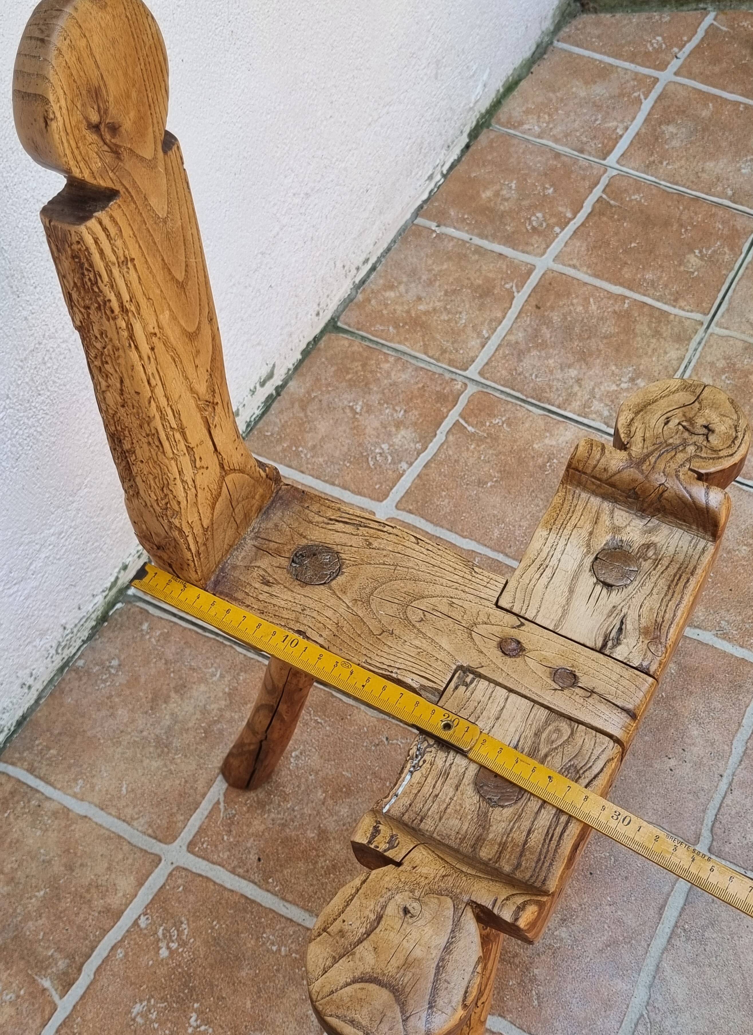 Brutalist chair in solid wood, European handcrafted work from the early 20th century.