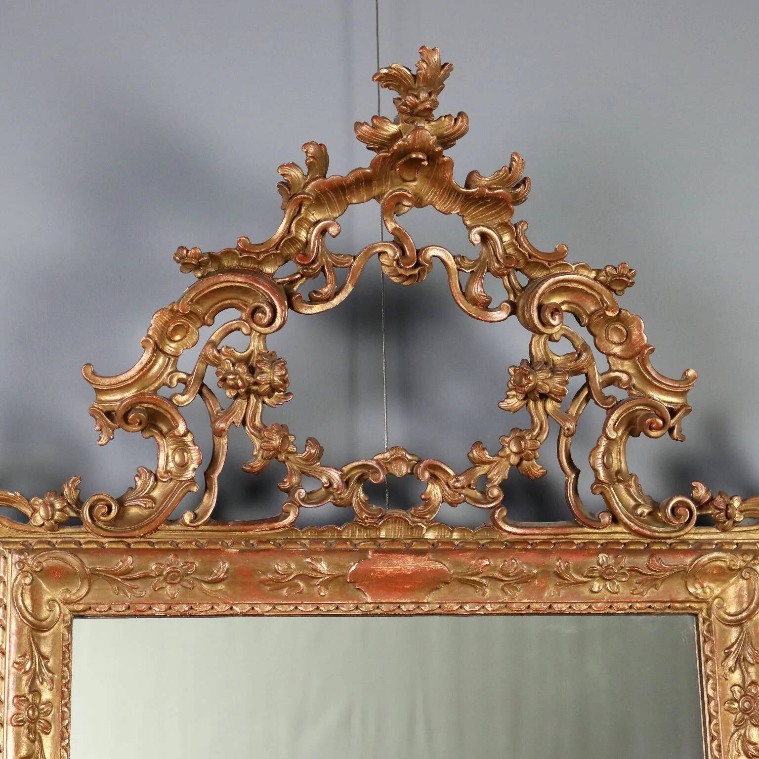 Antique carved and gilded wooden mirror, Italy, early 20th century.