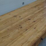 Old canteen in pine table