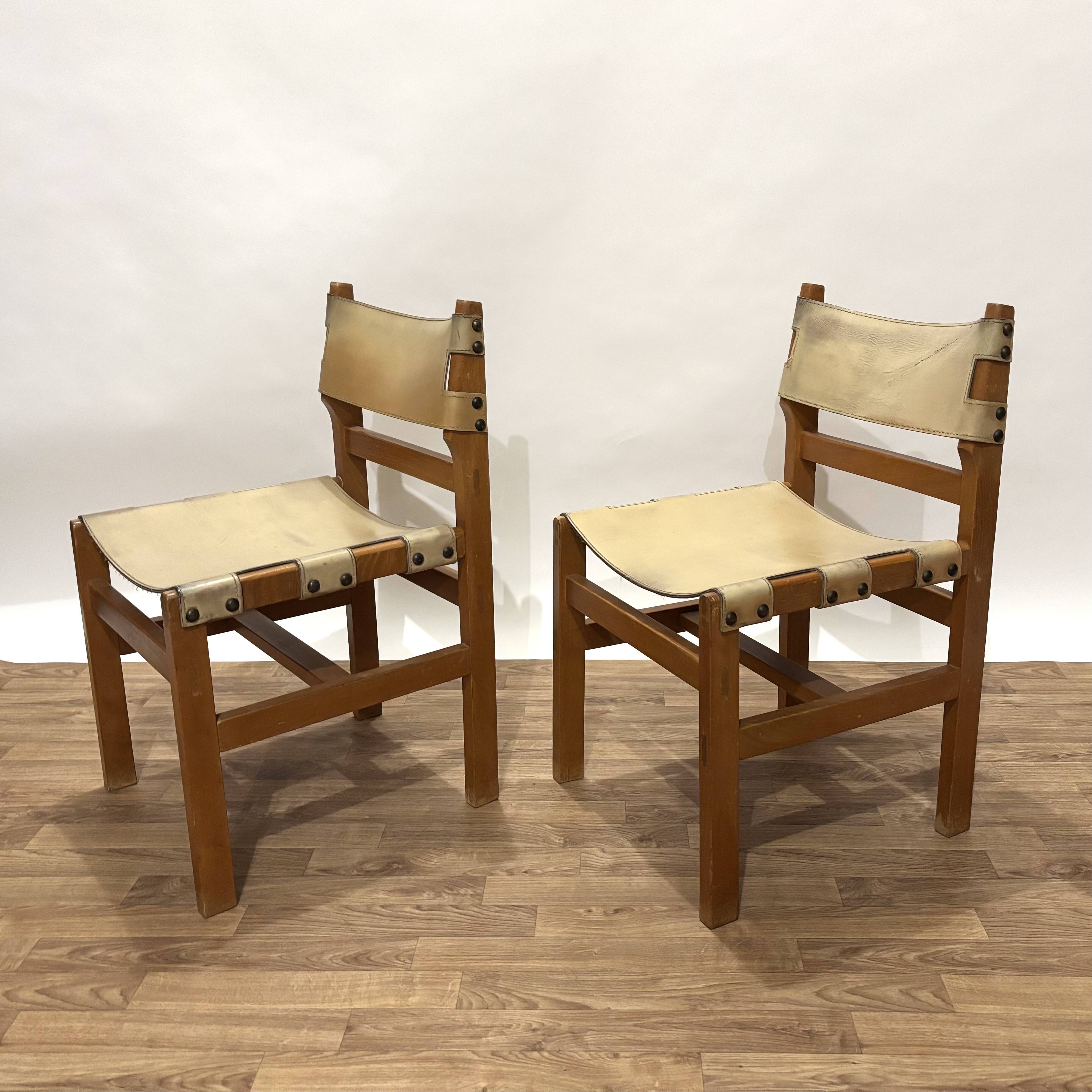 Pair of Maison Regain leather chairs