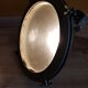 Old brass boat headlight with Holophane interior glass
