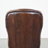 Sheep leather armchair with round shapes