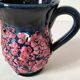 Vintage pitcher in midnight blue glazed ceramic with bright pink relief