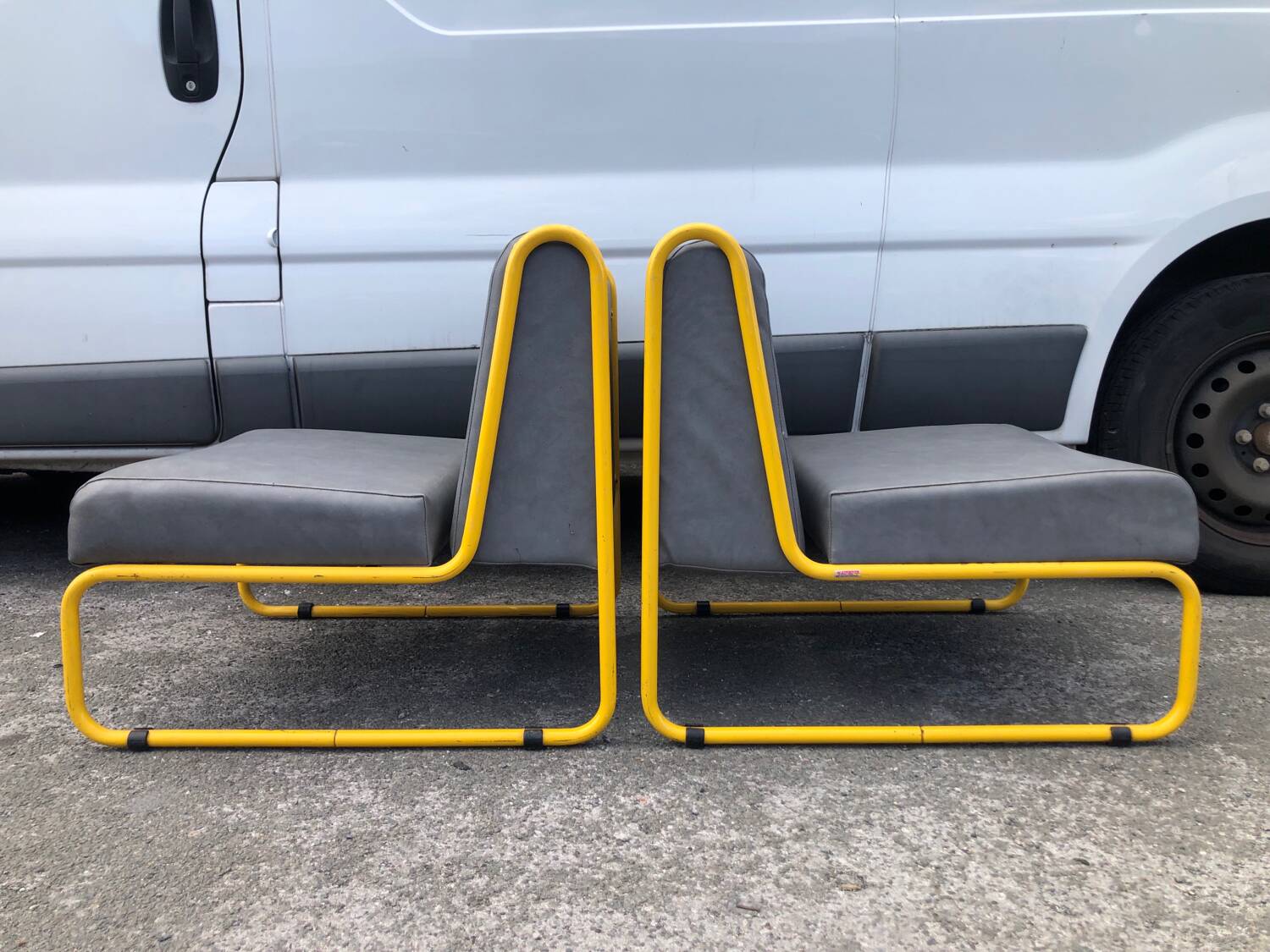 Pair of designer armchairs by Henri Julien