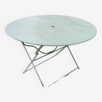 Old round folding metal table