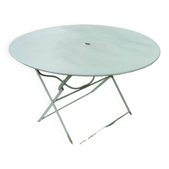 Old round folding metal table