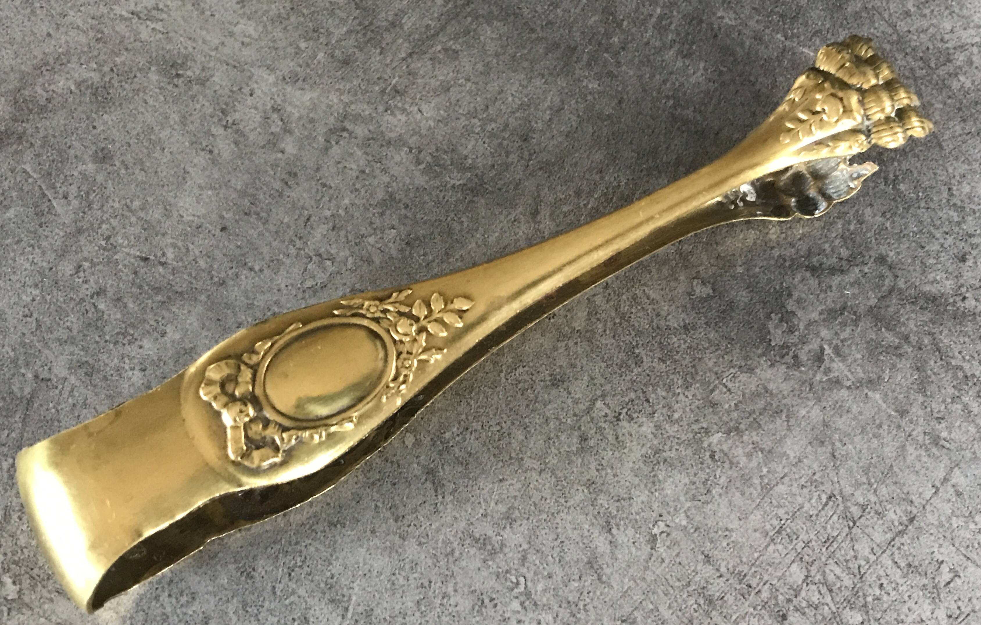 Sugar or ice cube tongs, gold star stamp with lion paw finish