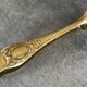 Sugar or ice cube tongs, gold star stamp with lion paw finish