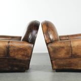 Set of two sheepskin Art Deco design armchairs with beautiful patina