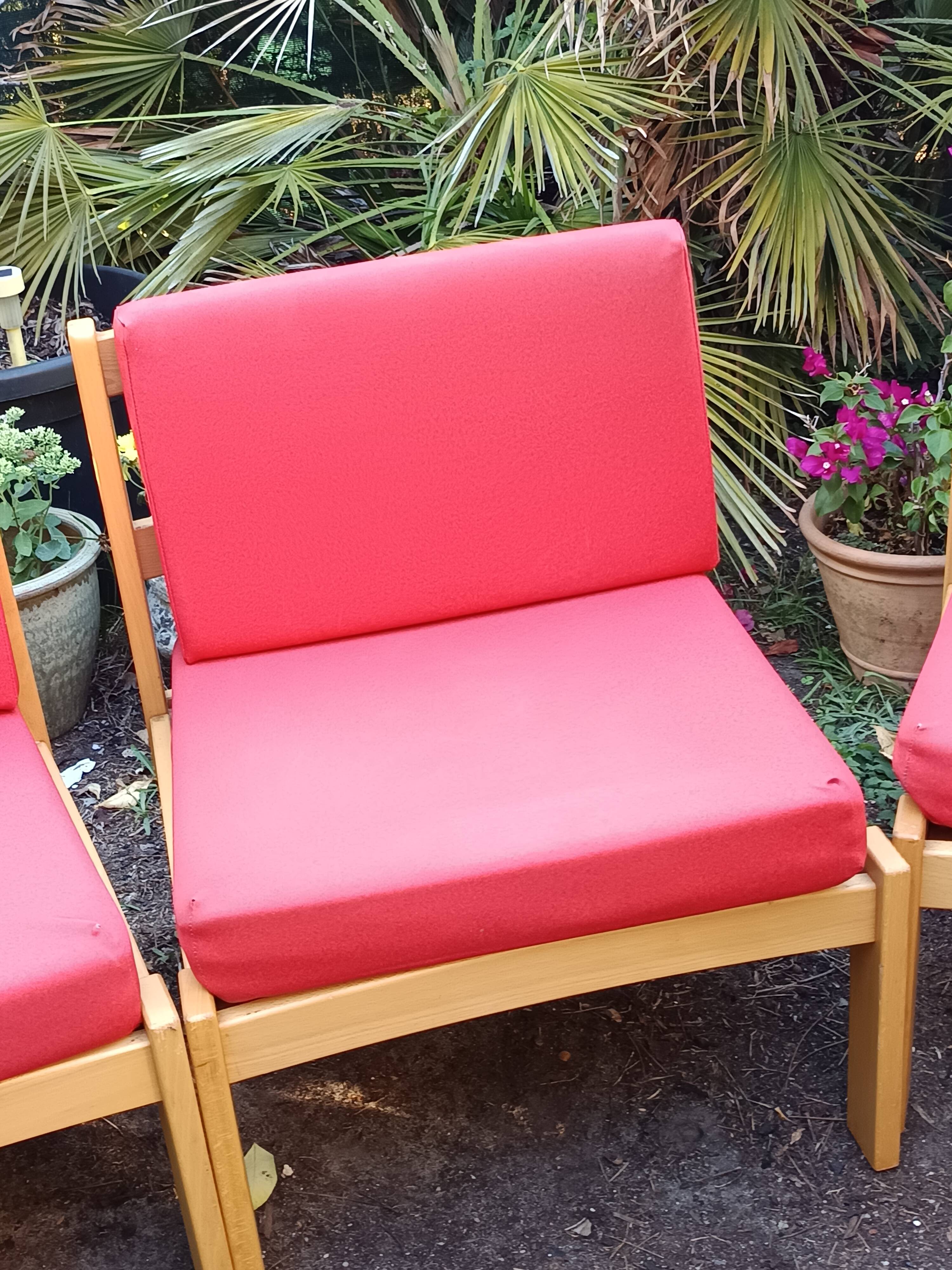Set of 3 vintage armchairs from the 60s/70s – light wood and red faux leather.