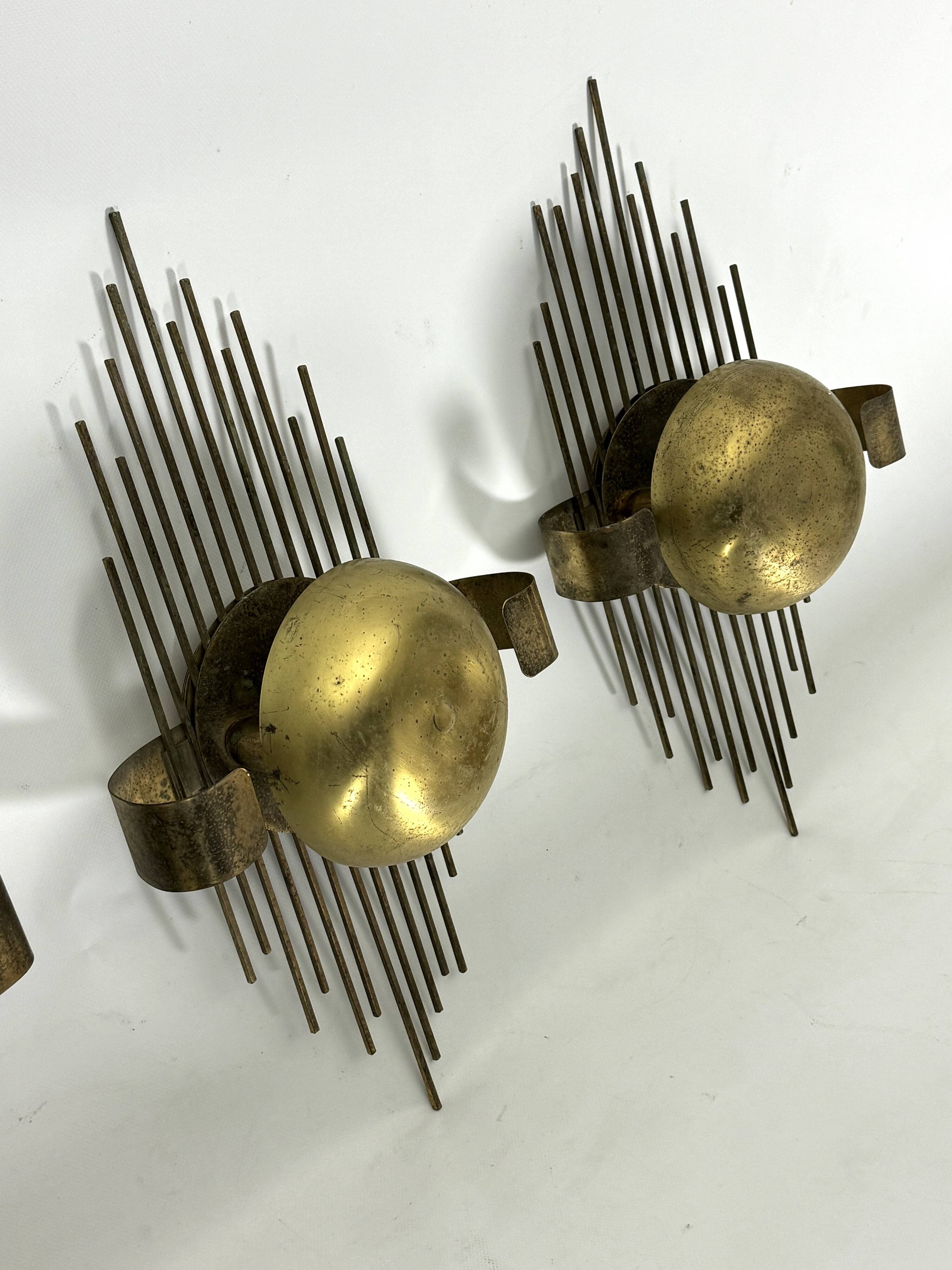 Mid-Century Set of three gilded metal sconces. Italy 1950s