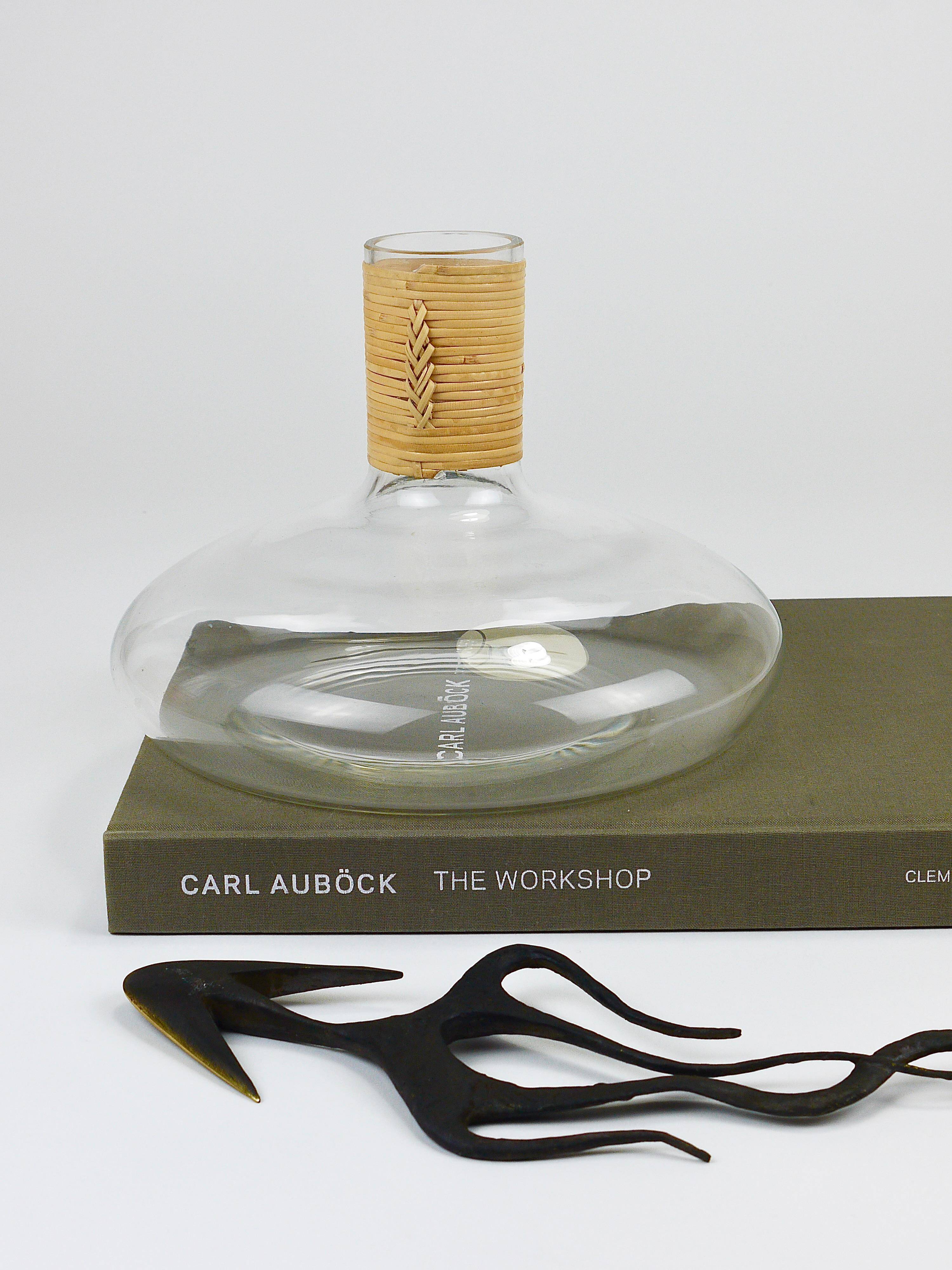 Vase by Carl Auböck decanter "Tuberkulinkolben" tall in rattan, Austria, 1950s.